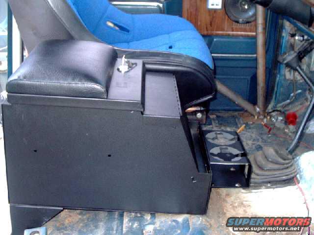 tuffyconsole8.jpg OOPS!!! The cup holder interferes with the transfer case shift lever. Remove and bolt it to the rear of the console instead.
