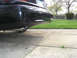 1999 Ford Crown Victoria - Rear view of a 1999 Ford Crown Victoria, showing the bumper and exhaust.