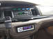 1999 Ford Crown Victoria - Dashboard view of a 1999 Ford Crown Victoria, an aftermarket stereo and a Whelen microphone.