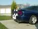 1995 Ford Probe - Rear view of a blue 1995 Ford Probe with white racing stripes and a spoiler.