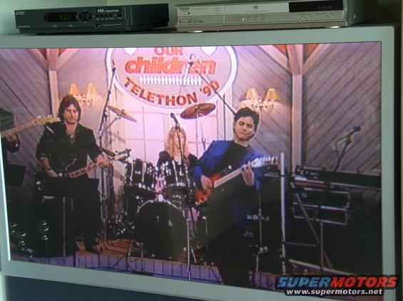 Band performing on stage during a telethon in 1990
