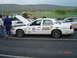 1999 Ford Crown Victoria - White 1999 Ford Crown Victoria race car with various sponsor decals and racing numbers.