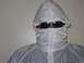 1986 Ford Bronco - A person is covered in a white protective suit, obscuring their face with sunglasses and a hood.