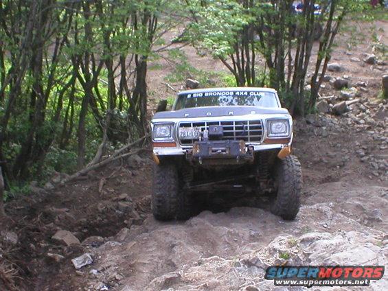 Front view of a 1978 Ford Bronco on a rocky trail
