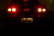 1995 Ford Probe - Rear view of a 1995 Ford Probe GT, showing illuminated brake lights and license plate.