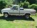 1988 Ford Ranger - This 1988 Ford Ranger pickup truck is shown from the side, parked on a grassy area with trees in the background.