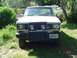 1988 Ford Ranger - This 1988 Ford Ranger pickup truck is parked outdoors on a grassy area with trees in the background.