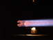 1988 Ford Bronco - Exhaust flame visible at night, with a faint object in the background.