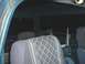 1982 Ford Bronco - The interior of the vehicle shows patterned seats and dark, reflective windows.