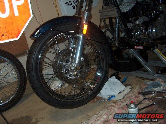 Motorcycle front wheel with chrome spokes and disc brake