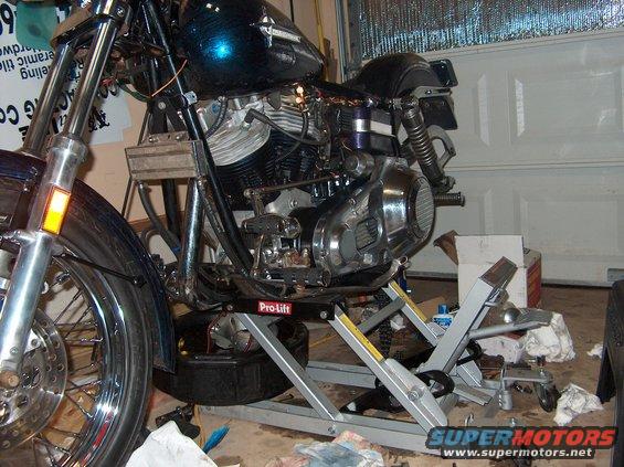 1976 Harley-Davidson Super Glide on a Pro-Lift motorcycle lift in a garage