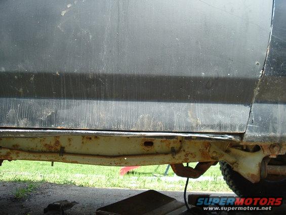 Bent rocker panel, sat on a stump...had to be winched off. Not as bad as it was before, had to bend it out so new door could close properly.