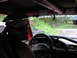 1993 Ford Bronco - Interior view of a 1993 Ford Bronco equipped with a roll cage, with another Bronco seen through the windshield.