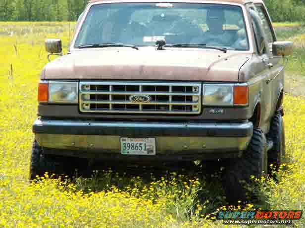 1988 Ford Bronco front view in yellow field
