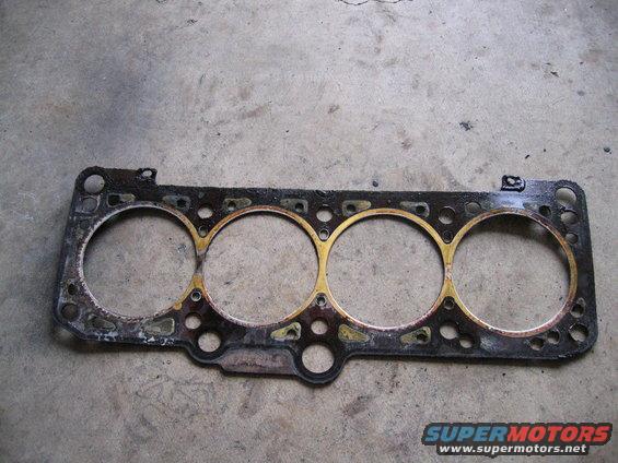 used engine head gasket with four cylinder openings