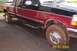 1979 Ford Bronco - Muddy Ford F-250 pickup truck parked on asphalt. Date stamp shows 05/01/2005.