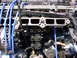 1998 Volkswagen Jetta - The engine's intake manifold and spark plug wires are visible in this close-up shot.