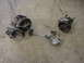 1998 Volkswagen Jetta - Various automotive parts, including a power steering pump, are laid out on a concrete surface.