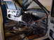 1998 Volkswagen Jetta - The interior of a car is shown with the dashboard and door panels removed, revealing extensive wiring.