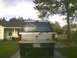1991 Mazda Navajo - This SUV's rear features a dented tailgate and a visible license plate, with another vehicle in the background.