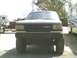 1991 Mazda Navajo - A lifted 1991 Mazda Navajo truck is parked outdoors, with other vehicles visible in the background.