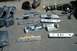 1991 Ford Crown Victoria LTD - Collection of automotive interior parts, including door handles and trim, scattered on the ground.
