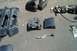 1991 Ford Crown Victoria LTD - Assorted car parts, possibly from a Ford Crown Victoria, are displayed on the ground.