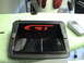 1997 Ford Probe - A close-up of a vehicle's GT brake light assembly, with a vintage cell phone on the side.
