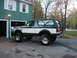 1994 Ford Bronco - Two-tone green and white 1994 Ford Bronco with aftermarket wheels and tires.
