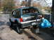 1994 Ford Bronco - Rear view of a lifted 1992 Ford Bronco on concrete blocks with a spare tire carrier.