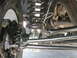 1994 Ford Bronco - Close-up view of the front suspension and steering linkage of an SUV.
