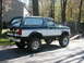 1994 Ford Bronco - This lifted Ford Bronco has a two-tone paint scheme and off-road tires.