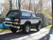 1994 Ford Bronco - This lifted 1994 Ford Bronco features a two-tone paint scheme and a rear-mounted spare tire carrier.