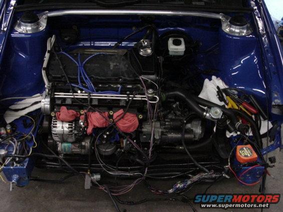 Engine bay of a 1998 Volkswagen Jetta with engine removed