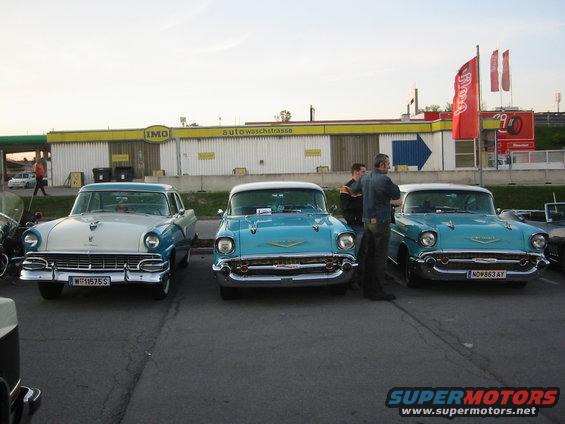 Three turquoise 1957 Chevrolet Bel Airs parked side-by-side