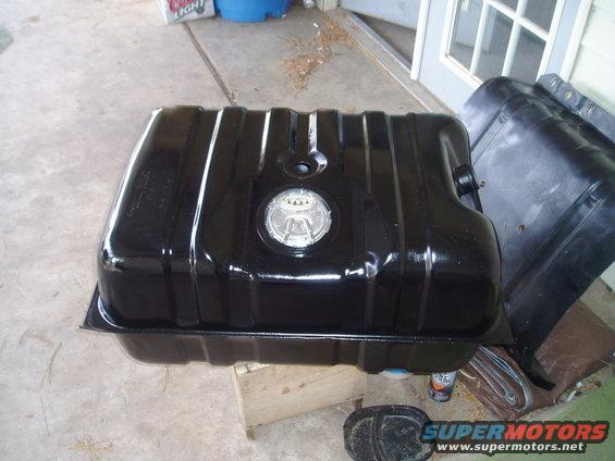 Black metal fuel tank with a silver sender unit assembly on top