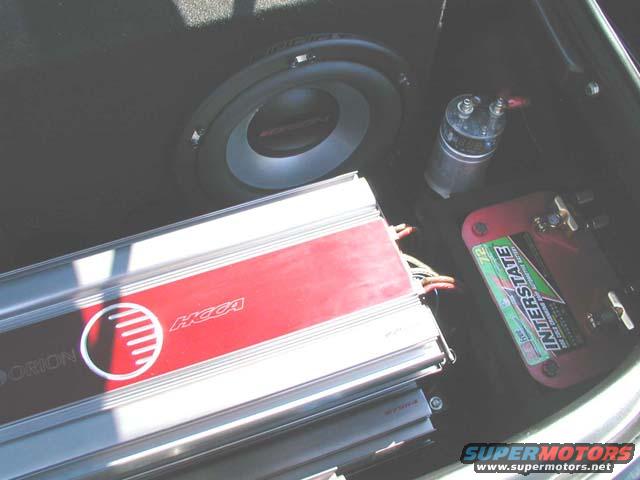 Car audio amplifiers and subwoofer in trunk, with Interstate battery