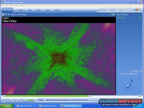 Windows Media Player playing Eagles' 'Take It Easy' with a colorful abstract visualizer