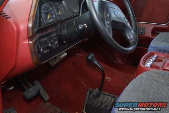 1989 Ford Bronco interior with manual shifter and dashboard gauges