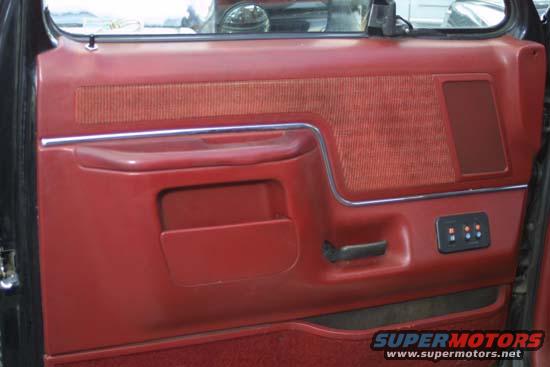 1989 Ford Bronco interior door panel with red fabric and plastic trim