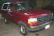1995 Ford Bronco - This 1995 Ford Bronco is shown in a three-quarter front view, its red paint and white top.