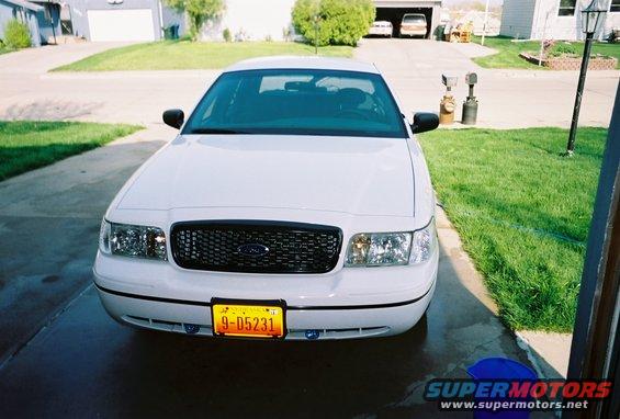 White 2000 Ford Crown Victoria front view with yellow license plate