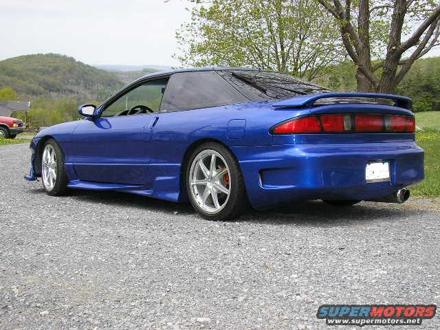 Blue 1994 Ford Probe with aftermarket body kit and spoiler