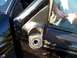 2003 Ford Ranger - The side mirror assembly of a black vehicle is shown detached from the door.