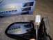 2003 Ford Ranger - A new side mirror is shown with its packaging, which details its features and installation.