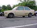 1998 Volkswagen Jetta - This tan two-door sedan, possibly a 1984 Volkswagen Golf or Jetta, is seen from the side with racing tires and a missing front bumper.