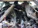 1998 Volkswagen Jetta - Vehicle interior packed with disassembled car parts and metal components.