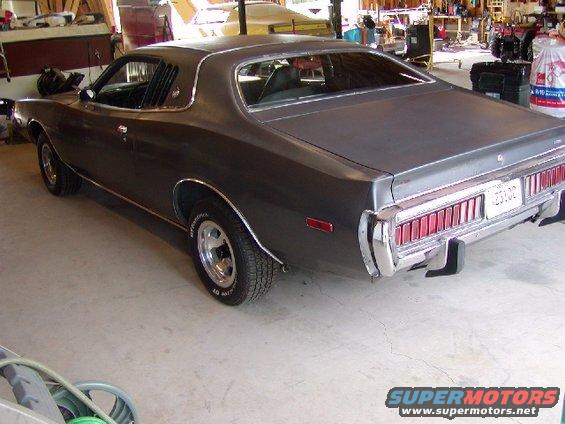 1973 Dodge Charger rear view, dark color, chrome bumper, trailer hitch