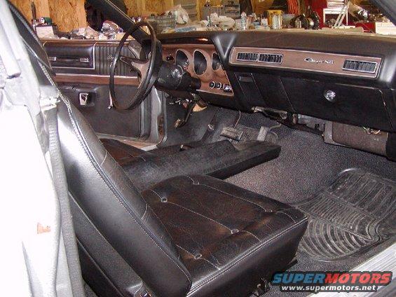 Interior view of a 1973 Dodge Charger, showing dashboard, steering wheel, and seats