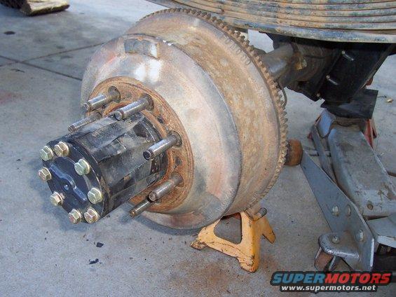 Rear axle hub and brake drum assembly on jack stands